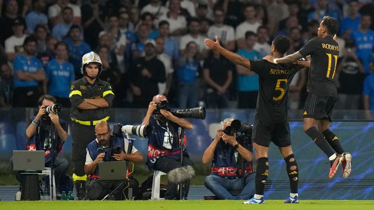 Real Madrid's Jude Bellingham, 2nd right, celebrates with Real Madrid's Rodrygo after scoring his side's second goal during the Champions League Group C football match between Napoli and Real Madrid at the Diego Armando Maradona Stadium in Naples, Italy , Tuesday, October 3, 2023. (AP Photo/Alessandra Tarantino)