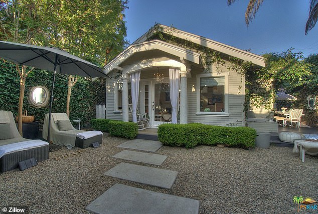 A view of the front garden and surrounding deck area