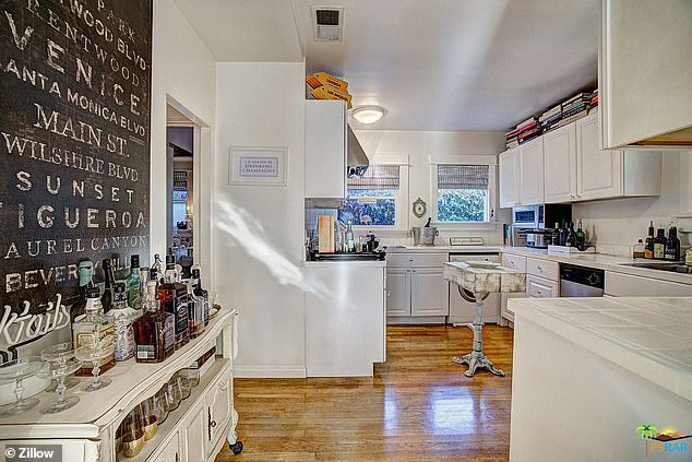 The kitchen uses refrigerator drawers to provide ample counter space