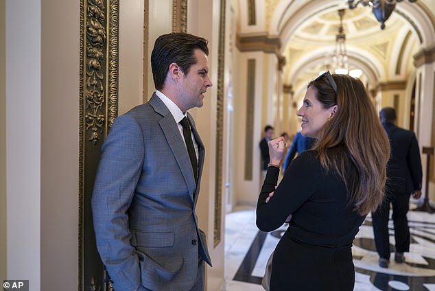 Rep. Matt Gaetz, R-Fla., and Rep. Nancy Mace, R-S.C., right, confer in the hallway outside the House chamber in late September.  She supported a resolution by Gaetz on Tuesday to vacate the seat