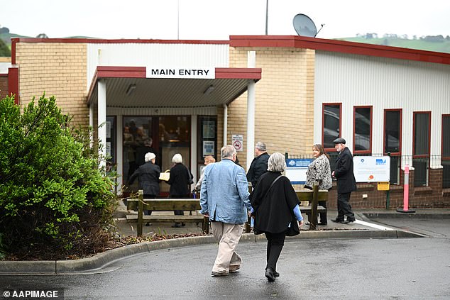 Loved ones of Mrs Wilkinson arrive at the memorial service in Korumburra, Victoria, on Wednesday