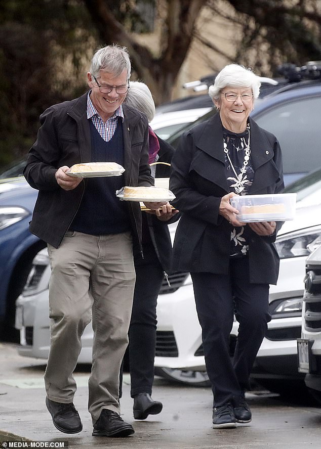 Attendees were seen carrying baked goods to the memorial service on Wednesday