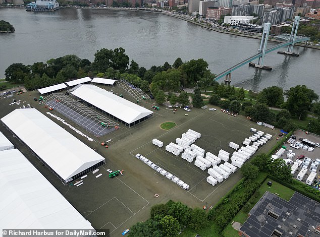 Tents are seen for new emergency shelters on Randalls Island in August.  NYC has opened more than 200 migrant shelters and is considering locations for additional shelters