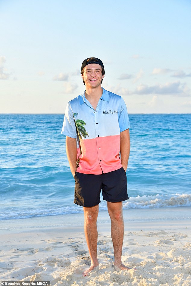 Caribbean adventure: The former Disney Channel enjoyed the sunny weather and the beach in a two-tone baby blue and salmon short-sleeved shirt and black shorts