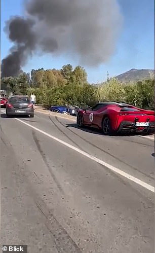 Video of the aftermath shows some of the sports cars not involved in the collision parked along the road