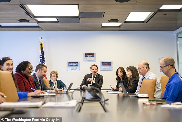 The Pension Benefit Guaranty Corporation spent $15 million on new furniture, which amounts to $14,400 for each of its $1,000 employees.  Pictured: Gordon Hartogensis, director of the Pension Benefit Guaranty Corporation, center, holds the leadership meeting on March 14, 2023, at the PBGC's new office in Washington, D.C.