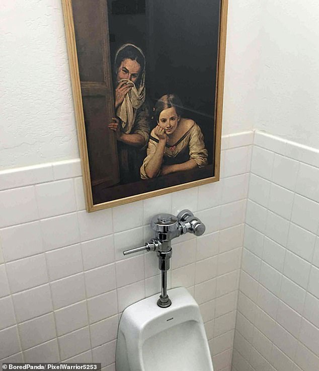 A mischievous placement of a painting above a urinal in an office toilet made it look like people were watching over you