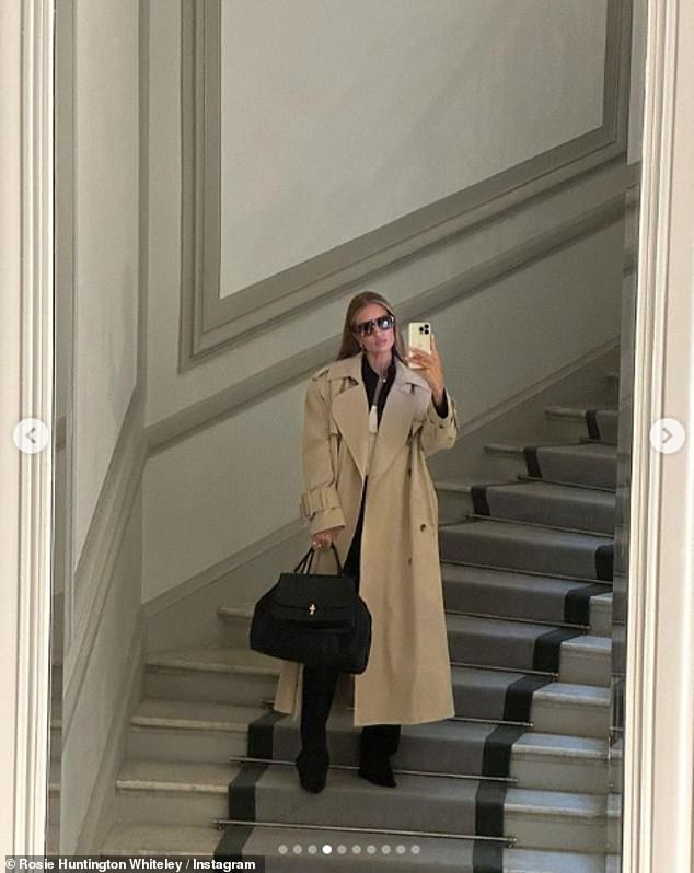 Trendsetter: Rosie also shared some selfies of her more casual ensembles, posing in a beige trench coat layered over a white tank top and a black shirt