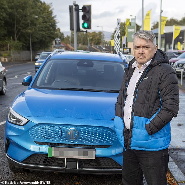 Mr Morrison with the MG ZS EV, which costs £30,000