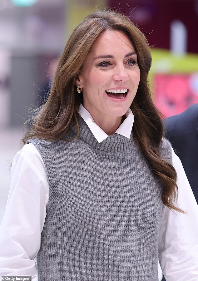 The princess, 41, wore her thick brunette locks in loose curls and opted for her signature pearl hoops