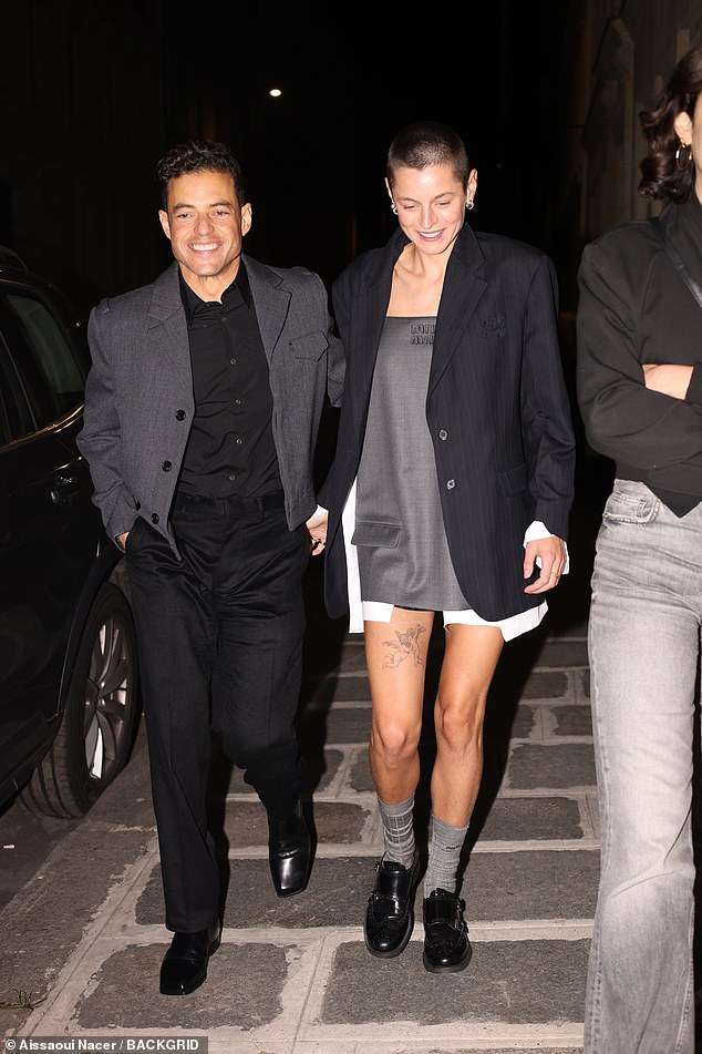 The night before: Emma was seen holding hands with Rami Malek, 42, as they left the Miu Miu afterparty during Paris Fashion Week on Tuesday night