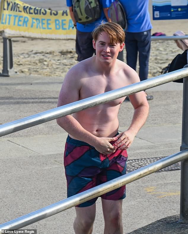 Wow: The actor, 19, showed off his toned physique during filming as the cast shot a series of beach scenes in Lyme Regis