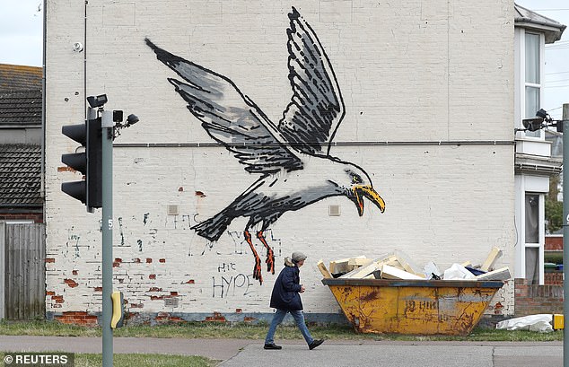 Artwork by Banksy in Lowestoft, Suffolk, depicts a spray-painted seagull sitting in a bin full of polystyrene chips