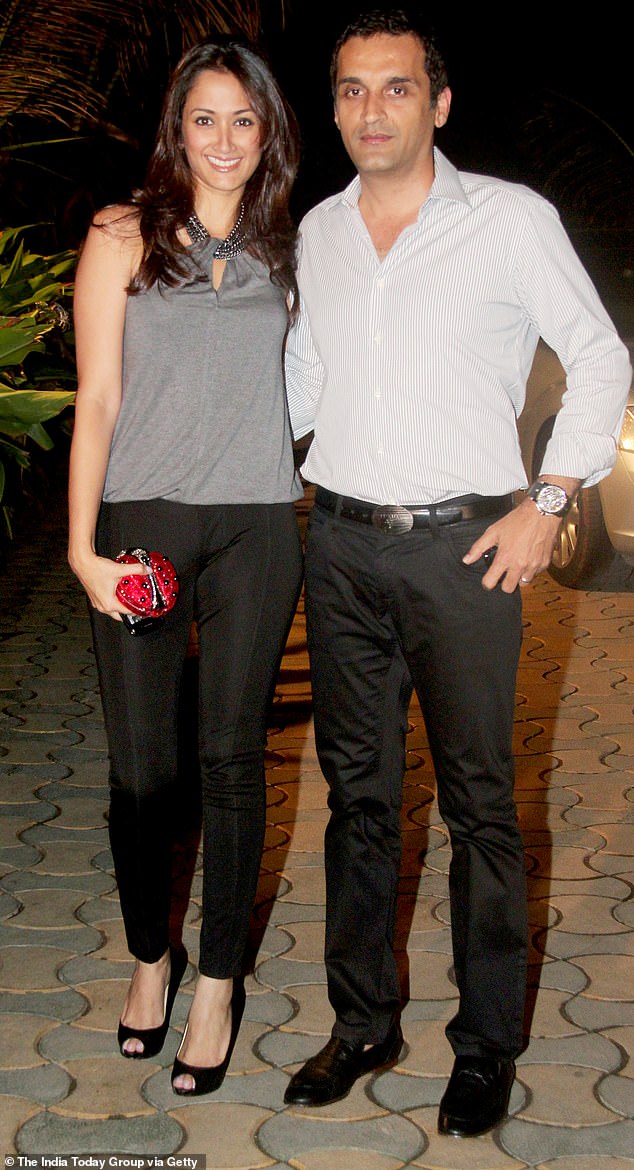 Gayatri, pictured here with her husband Vikas at a party for the film 'Speedy Singh' in 2011, told Indian media after the crash: 'By God's grace we are fine'