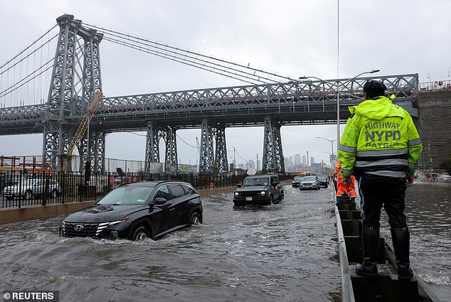 Scientists blame increased heavy rainfall due to climate change for recent flooding in the New York region (pictured).  Warmer air can hold more water, so precipitation increases on average across the world, the Met Office said