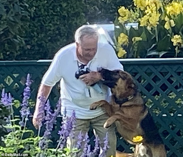 The incident, which was unwittingly caught on camera by a tourist taking photos on September 13, shows the two-year-old German shepherd sinking its teeth into the left arm of groundskeeper Dale Haney.