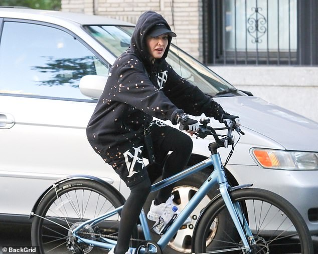 Queen of Pop: The star showed off her flawless complexion while cycling