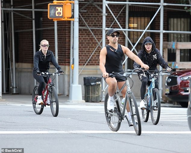 With friends: The star looked happy as she went cycling with some friends