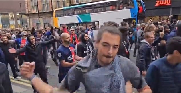 Another video on social media showed a fan throwing a punch as PSG supporters marched through Newcastle