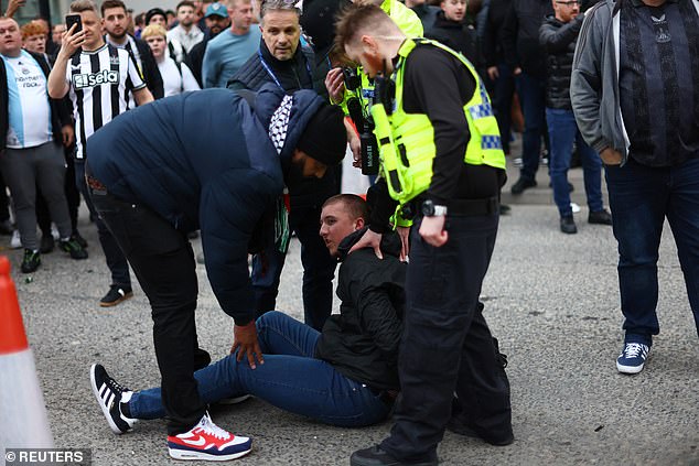 One supporter is arrested on the spot by the police after the conflict prior to the match