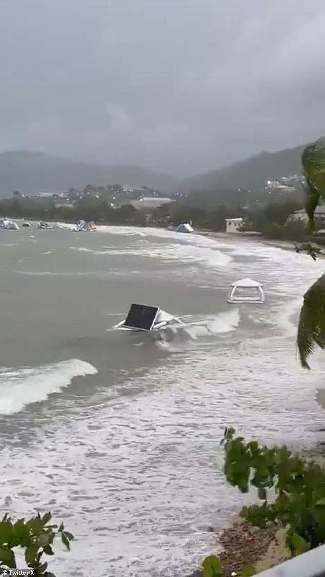 Phillippe drenched the northeastern Caribbean on Tuesday, with all schools in the US Virgin Islands closed and multiple power outages reported in the area amid rain showers and lighting.