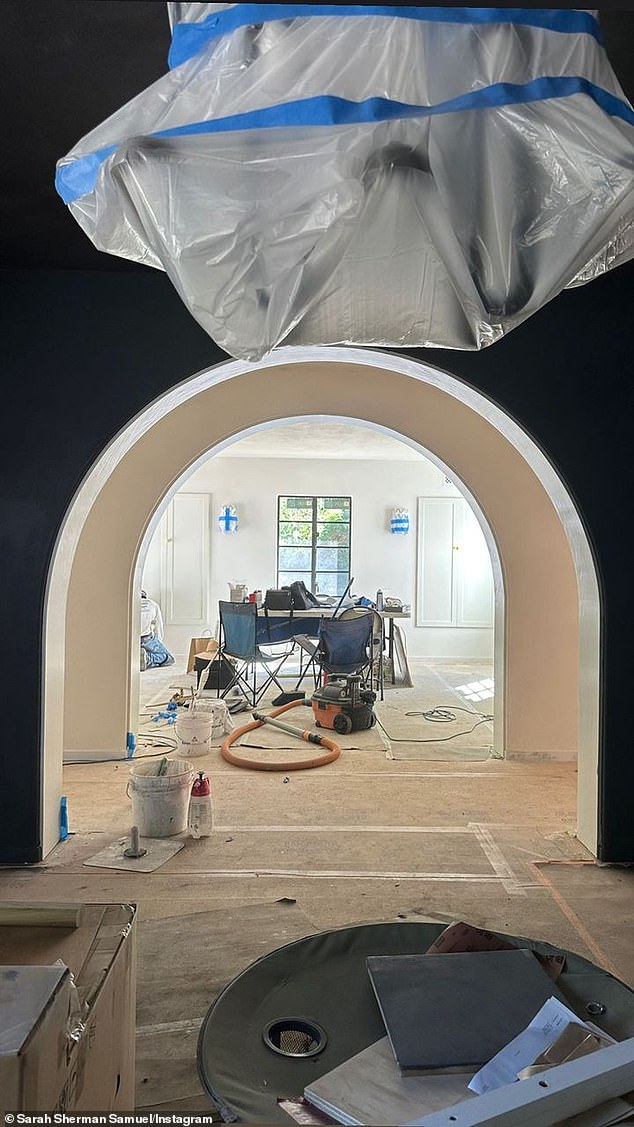 Work in progress: the arches extend into the house, while another image depicted double arches with a visible work table and materials used during the project