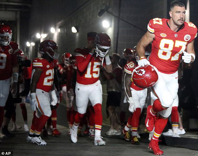 Beefcake parade: Travis may have complied with standard etiquette by leaving MetLife Stadium with the other Kansas City Chiefs instead of his new pressure