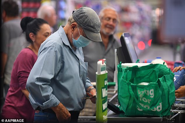 Mr Urquhart said older Australians have the money to spend and are a key driver of the market (pictured, elderly customer at a Woolworths checkout)