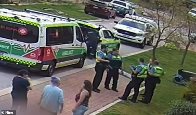 Neighbors tried to punch Ms Piil's fence and use a snake to distract the attacking dogs before drawing their weapons (pictured, emergency services outside Ms Piil's home on Saturday)