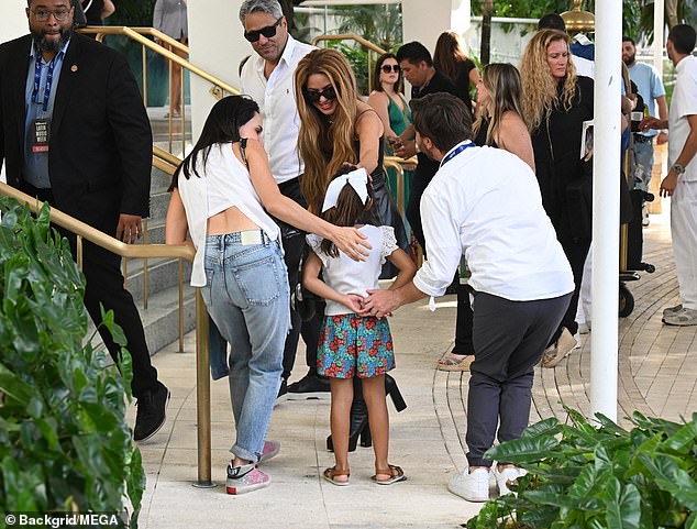 Sweet: Shakira looked like a queen arriving at the Faena Forum, where she was surrounded by security and staff.  As she entered the building, she stopped to talk to a little girl who was excited to see her