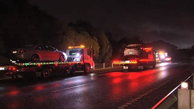 Cars are being taken away by tow trucks along the Frankston Freeway on Tuesday evening