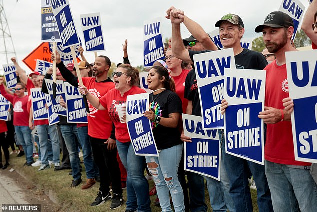 Workers stand on the picket line outside the General Motors Lansing Delta plant in Michigan