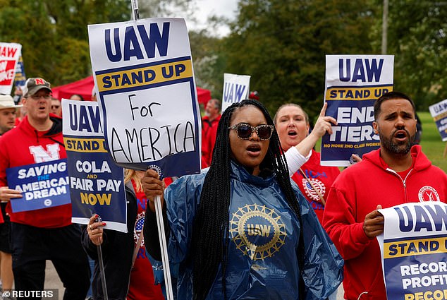 Strikers protest at the picket line on the day U.S. President Joe Biden joined them outside GM's Willow Run Distribution Center, in Belleville, Wayne County, Michigan, on September 26, 2023