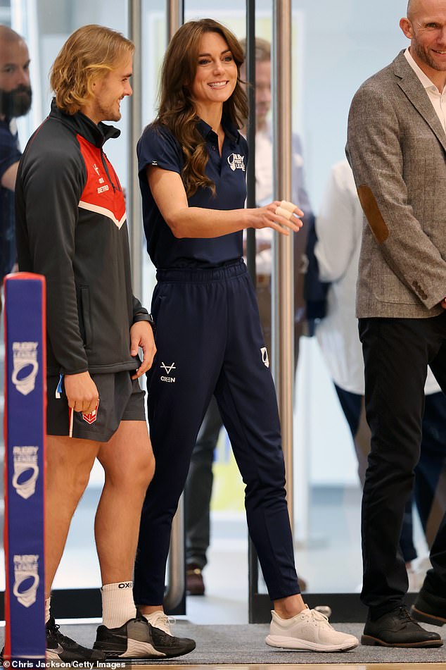 While the royal family has been opting for sophisticated suits lately, she wore her navy blue Rugby League polo shirt instead