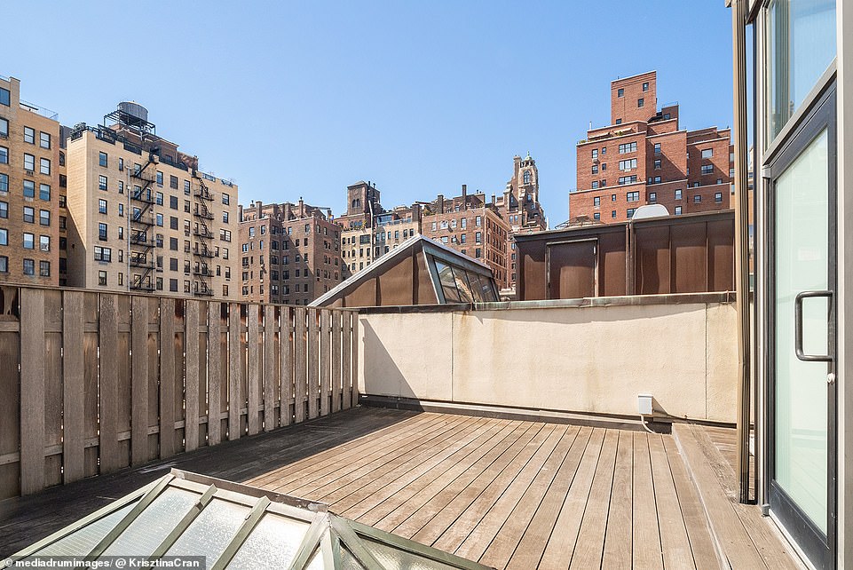 Behind the basketball court is a large, sun-drenched terrace, complete with a barbecue, dining area and jacuzzi