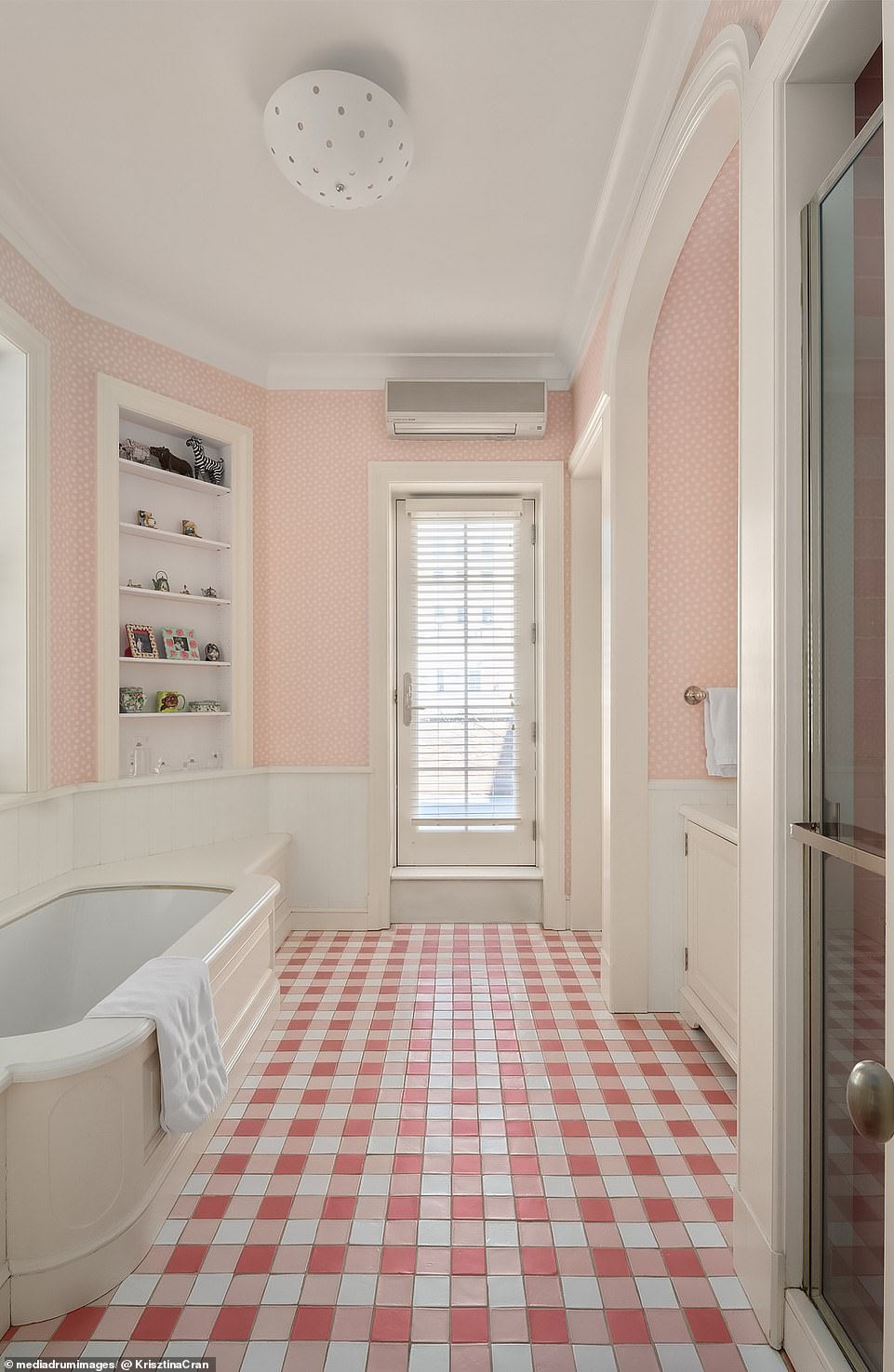 There are a total of seven full bathrooms and four half bathrooms throughout the townhouse.  In the photo: Bathroom with private terrace