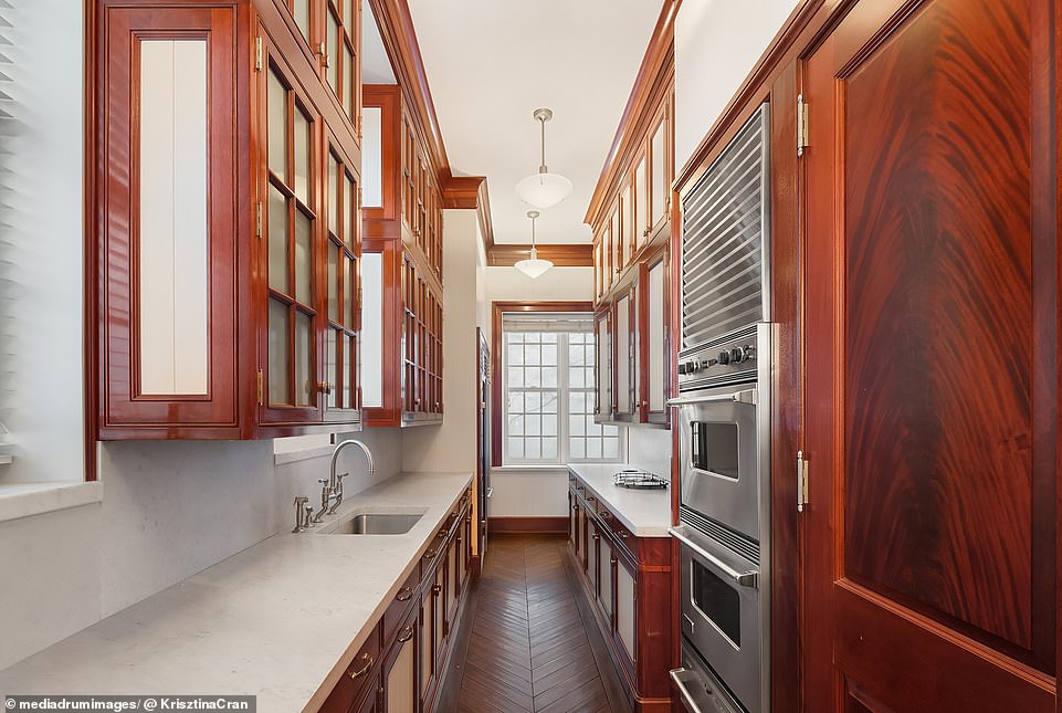 The servant's utility room has its own ovens and stairs leading to the kitchen downstairs