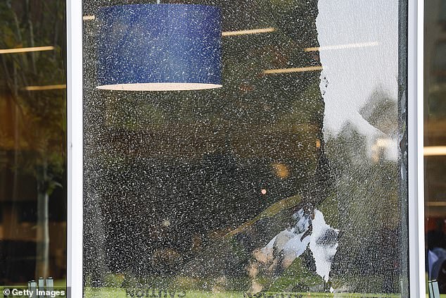 The shattered windows resulting from the gunfire shown Wednesday