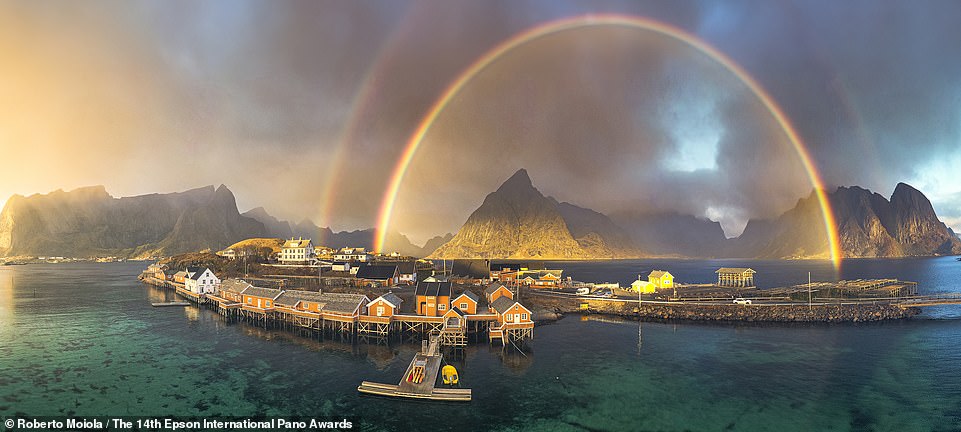 Italian photographer Roberto Moiola captured this image of a rainbow over Reine Bay on Norway's Lofoten Islands.  It ranks joint 19th in the Open Natural Landscapes category