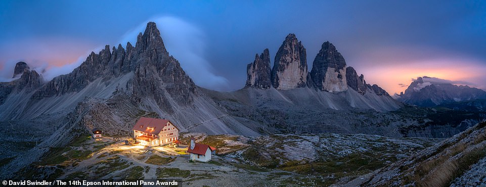 This photo by David Swindler, titled 'Blue Hour', shows red-roofed huts next to the three peaks of Lavaredo in the Italian Dolomites.  It takes joint 37th place in the Open Built Environment category