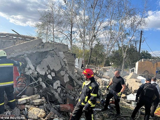 The rocket attack destroyed a cafe and a shop in the village of Hroza in Kharkiv's Kupyansk district in mid-afternoon, which at the time was filled with men, women and children.  In the photo: fire brigade on site