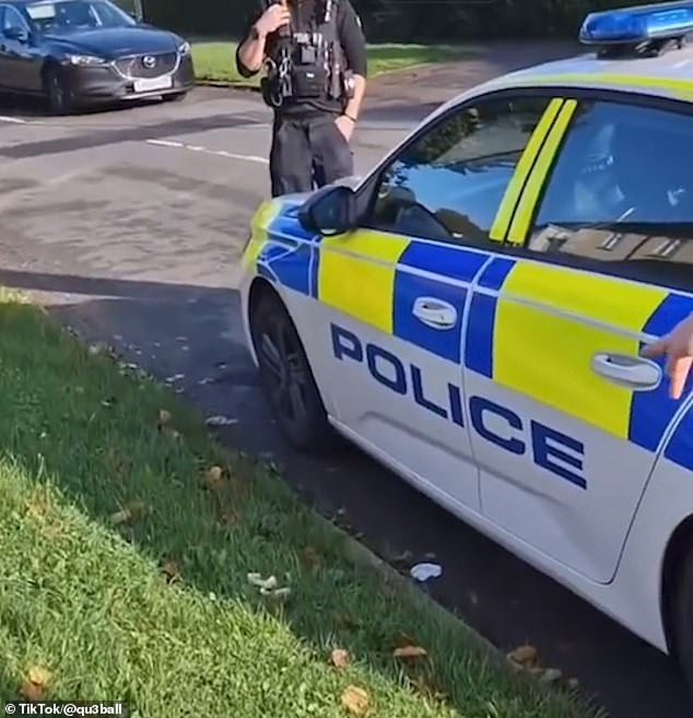 The offending sandwich crusts can be seen on the grass verge next to the police car door