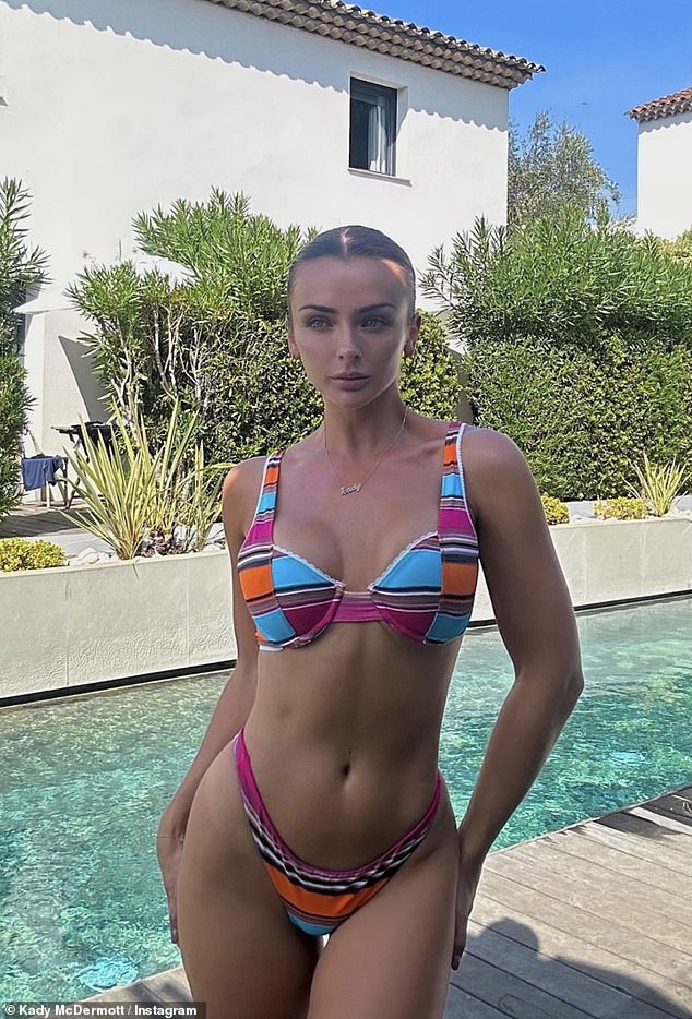 Hot: The former Island star, 28, showed off her enviable body as she slipped into a blue, pink and orange bikini while soaking up the sun in St. Tropez