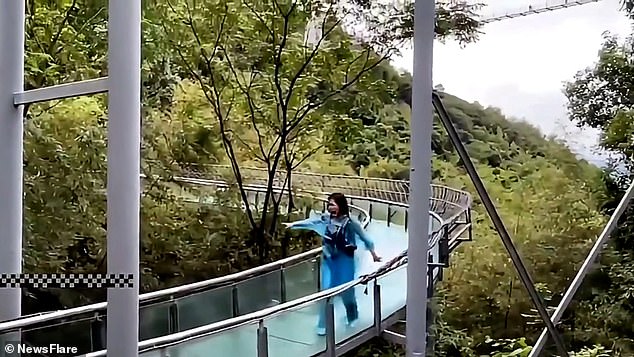 A woman screams as she tries to get to safety after being knocked from her boat