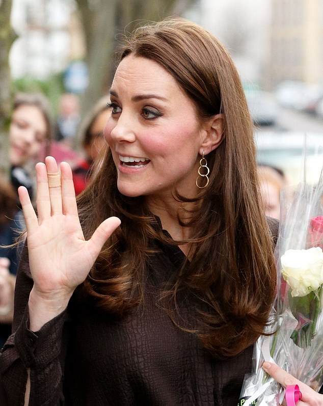 Kate with a plaster on her middle finger as she waved to royal fans in January 2015