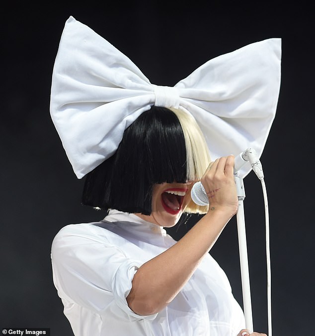 While presenting the award, the star, who is known for masking her face with a wig after admitting she struggles with body image while being a pop star, revealed to the audience that she had gone under the knife (pictured in 2016)