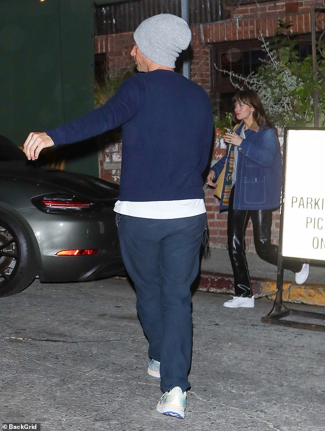 On the road: As they left the birthday party and headed to their car, Chris proved to be a true gentleman as he held the door for his beautiful girlfriend