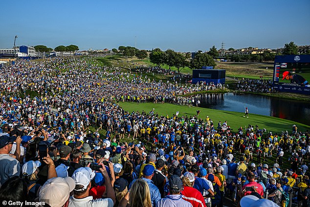 Fans surround the 18th green as Team Europe's Shane Lowry at Marco Simone Golf Club on October 1