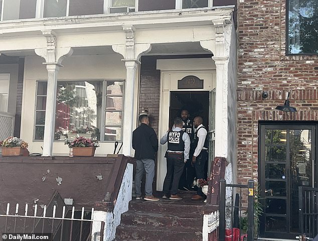 Detectives arrived at the suspect's home in Brooklyn on Thursday morning.  DailyMail.com was there when they executed the search warrant