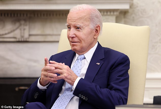 On Thursday, Biden told reporters in the Oval Office that he is forced to build a border wall because the money was already appropriated by Congress in 2019.  When asked if he thought the border wall was effective, the president said: 'No'